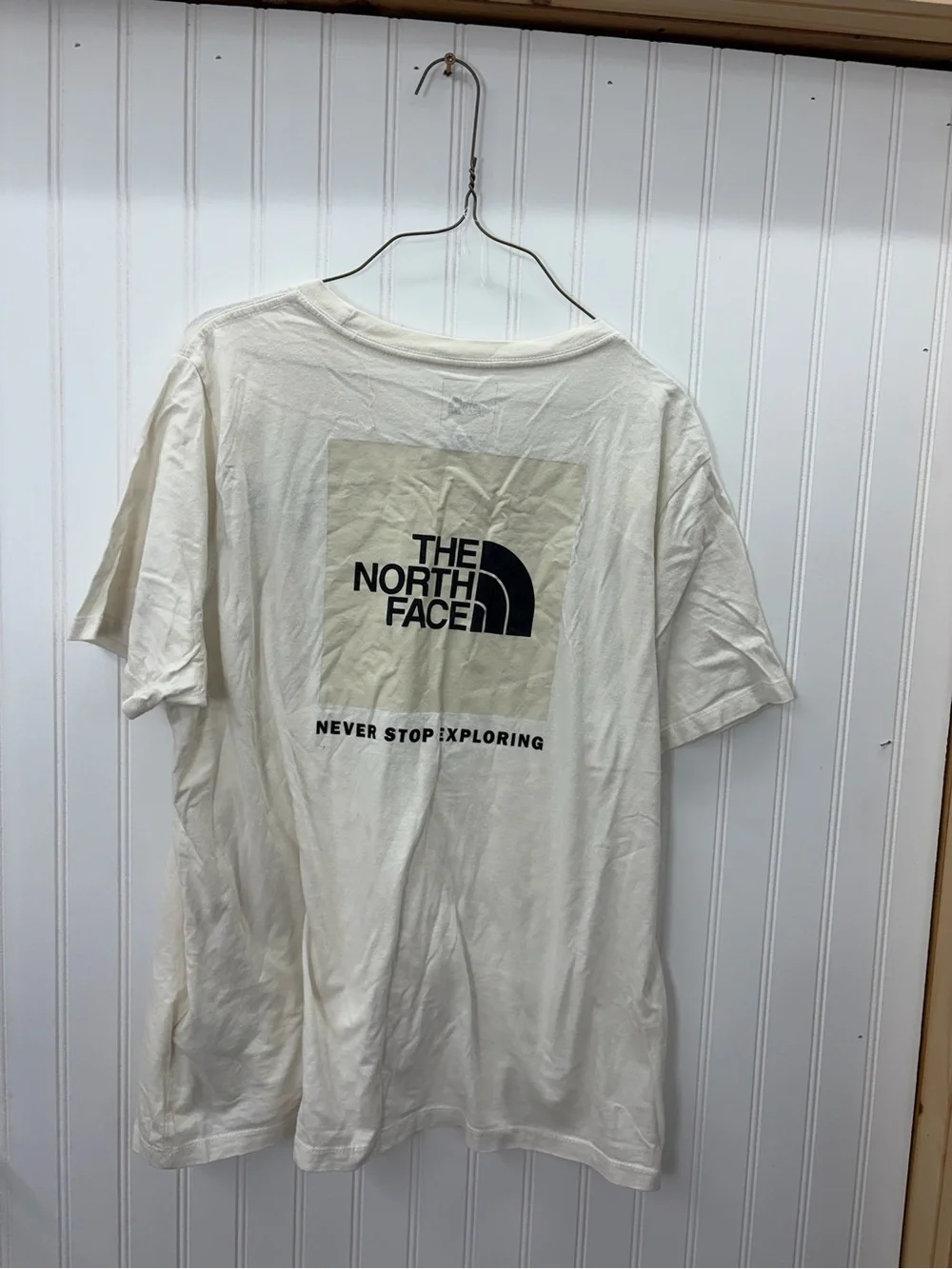 The North Face Men’s Cream Short-Sleeve Logo Tee with Black Chest Emblem
